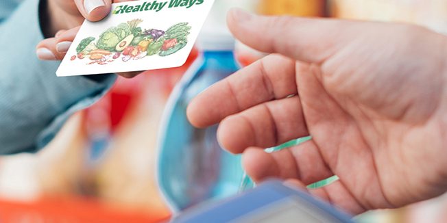 Woman at the store checkout Woman at the store checkout